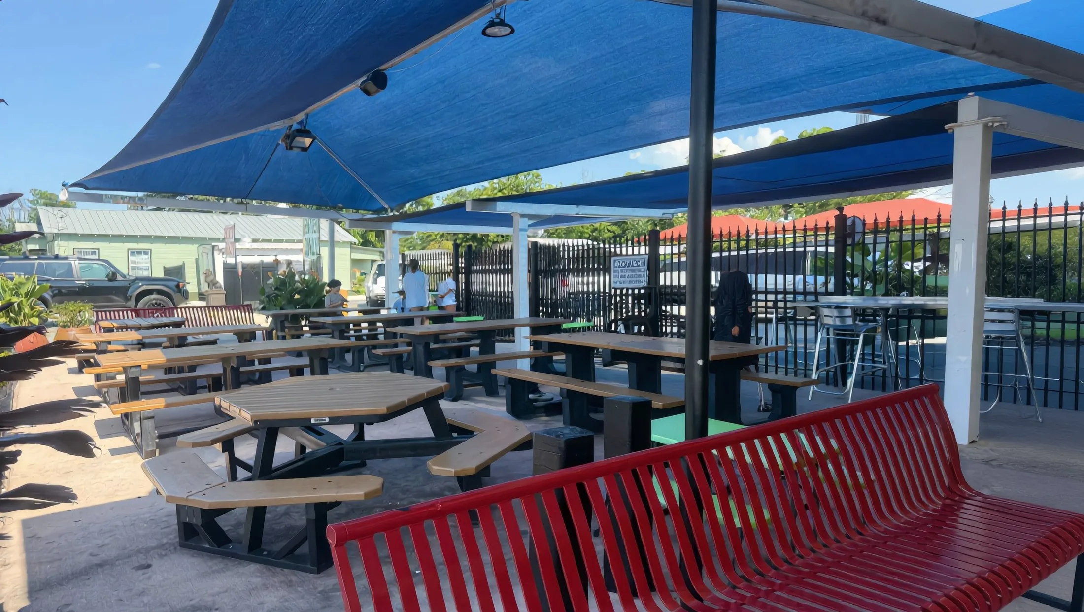 The Las Nieves patio — the 'Since 2001' wall, the logo bench and the Bigfoot mascot